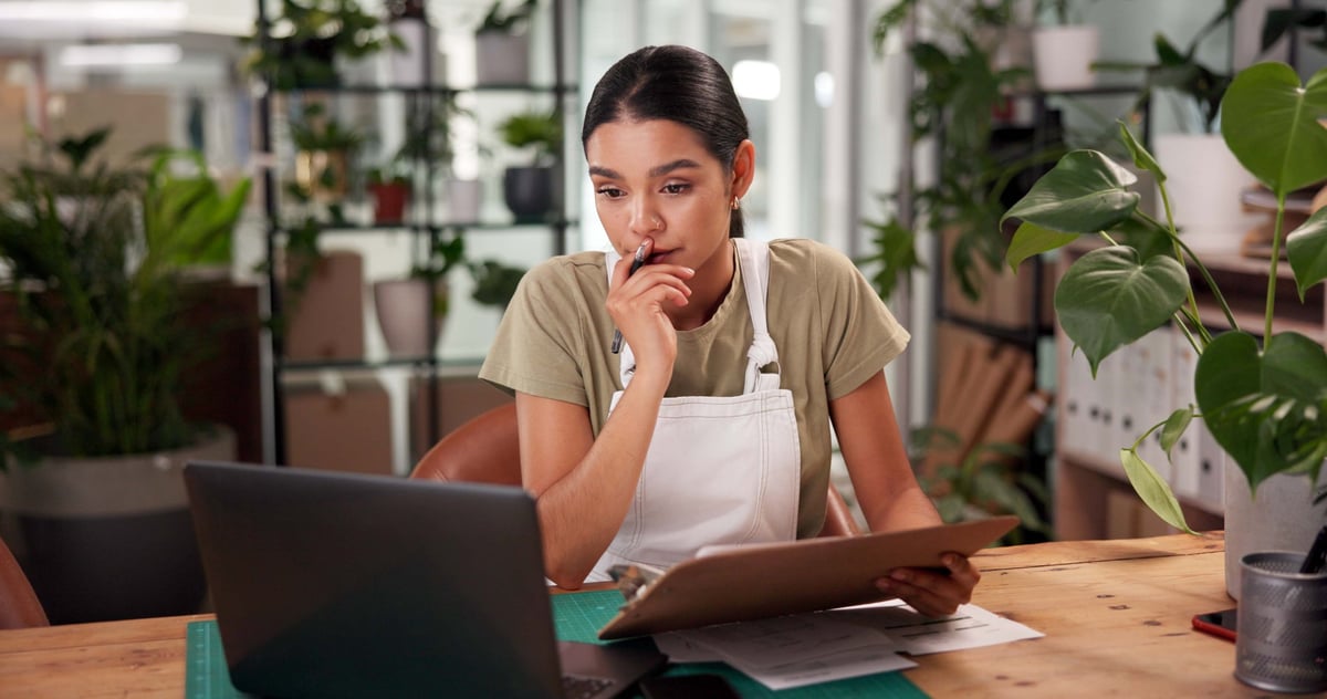 A small business florist working in her shop